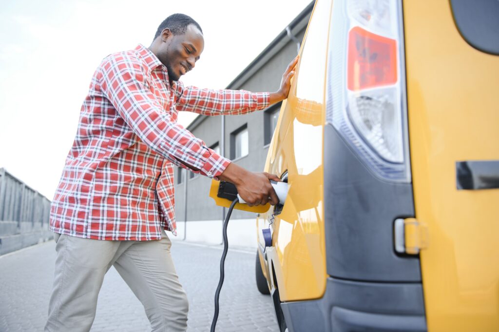 man charging commercial vehicle